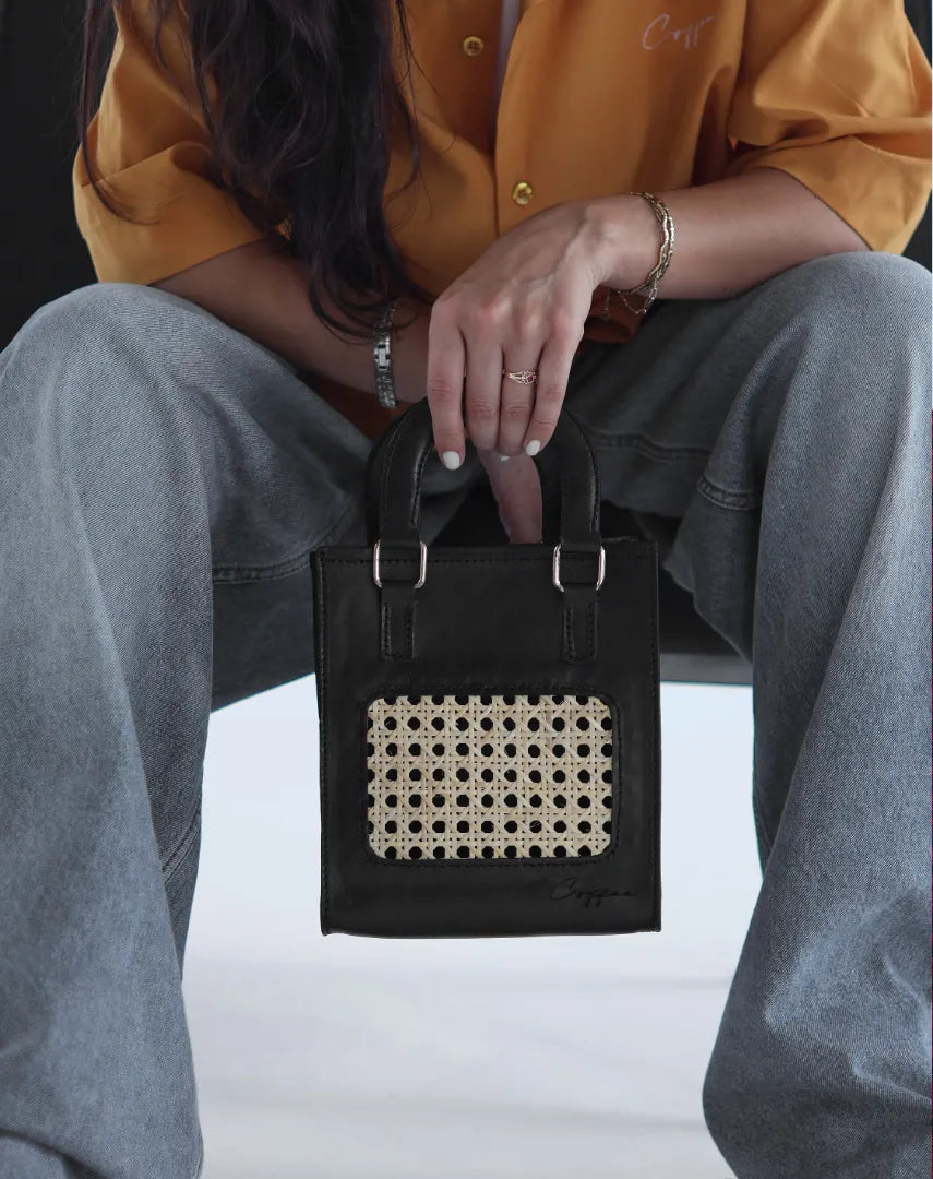 Coffee OG Strap Bag holding by a woman model